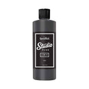Black bottle of Speedball Studio Plus ink on a white background