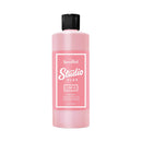 Pink bottle with black cap labeled 'Speedball Studio Plus' on a white background