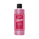 Pink bottle of Speedball Studio Plus ink with a black cap on a white background