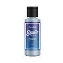 Bottle of Speedball Studio Plus Cerulean cleaner on a white background