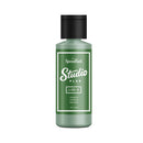 Green bottle labeled 'Speedball Studio Plus' on a white background