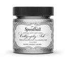 Speedball acrylic calligraphy ink jar with black lid on a white background