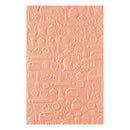 Pink silicone baking mat with kitchen-themed designs on a white background