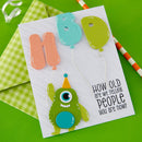 Birthday card with a green monster, colorful balloons, and text on a green background
