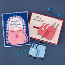 Two greeting cards with travel-themed designs on a blue background