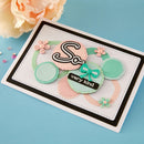 Decorative card with colorful text and floral elements on a blue background