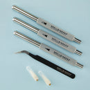 Set of Spellbinders craft tools on a light blue background