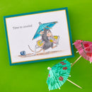 Card with a mouse holding a blue umbrella and small umbrellas on a green background