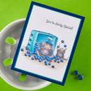 Card with illustration of two mice and blueberries on a white plate with green background