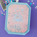 Decorative card with zodiac design on a purple background