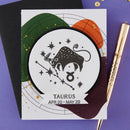 Card with Taurus zodiac design on a colorful background