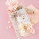 Decorative card with floral elements and text on a pink background