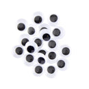 Set of black and white googly eyes on a white background
