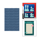Three items: a blue textured sheet, a framed art piece with chess pieces, and a green packaging of Spellbinders 3D foam sheets.