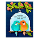 Decorative card with two colorful birds on a branch and floral elements.