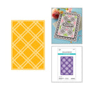 Spellbinders cutting dies with a card and patterned paper on a white background