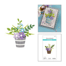 Floral arrangement, card with floral design, and Spellbinders die cut on a white background