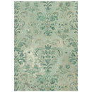 Decorative green and beige patterned rug on a white background
