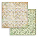Two sheets of floral paper with daisy patterns on a white background