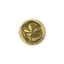 Gold decorative button with a central design on a white background