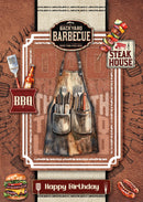Birthday card with barbecue-themed design featuring an apron, utensils, and grill tools on a brown background.