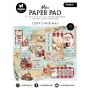 Cozy Christmas-themed paper pad with various designs on a white background