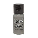 Bottle of Tim Holtz Distress Paint on a white background