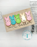 Easter card with colorful bunny stickers and 'Happy Easter' text on a white background.