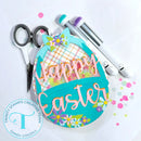 Decorative Easter sign with 'Happy Easter' text, scissors, and markers on a white background.