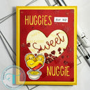 Red card with yellow border featuring heart design and text 'Huggies for my sweet nuggie' on a white background.