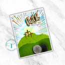 Card with 'Faith over fear' text and cross design on a white marble background