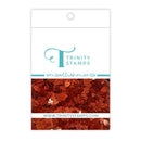 Trinity Stamps embellishments packaging with a close-up of decorative elements on a white background.