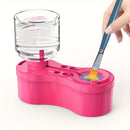 Pink art station with water bottle, paintbrush, and paint tray on a white background