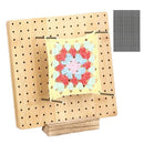Wooden pegboard with a crocheted square on a white background