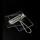 Clear plastic roller with metal handle on a black background