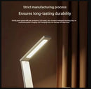 Desk lamp with text about manufacturing process and durability