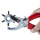 Hand holding a red and silver hole puncher on a white background