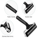 Dog grooming tool with plastic handle, rubber roller, and stainless steel frame on a white background.