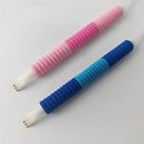 Two pens with colorful, textured grips on a light gray background