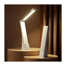 Modern desk lamp on a wooden platform with a warm background