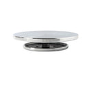 Round metal turntable on a white background