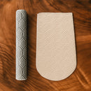 Two textured ceramic items on a wooden surface