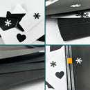 Collage of black and white stationery items with snowflake and heart designs.