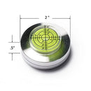 Circular level with green bubble and measurements on a white background