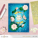 Greeting card with fish and flowers design on a blue background, featuring the brand 'Altenew'.