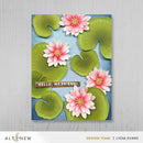 Card with pink flowers and green leaves on a blue background, featuring the text 'Hello, My Friend!' and the Altenew logo.