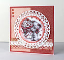 Greeting card with a teddy bear holding a cupcake and decorative lace border on a red background.