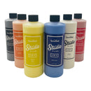 Set of Speedball Studio Plus ink bottles in various colors on a white background