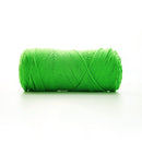 Green skein of yarn on a white background