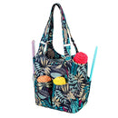 Multicolored floral-patterned tote bag with yarn and knitting needles on a white background